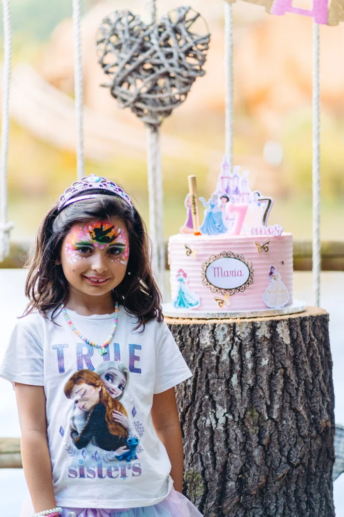 A joyful children's birthday party with face painting, themed decorations, and smiling kids in Ericeira
