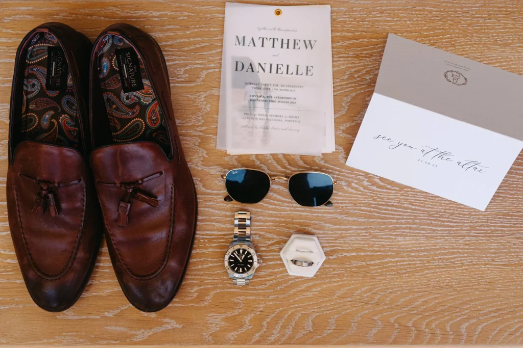 Close-up of a groom’s wedding details including shoes, tie, and accessories.