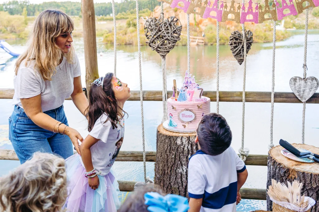 A joyful children's birthday party with face painting, themed decorations, and smiling kids in Lisbon cake cutting with happy birthday song