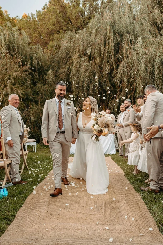 the couple getting out of the aisle just got married