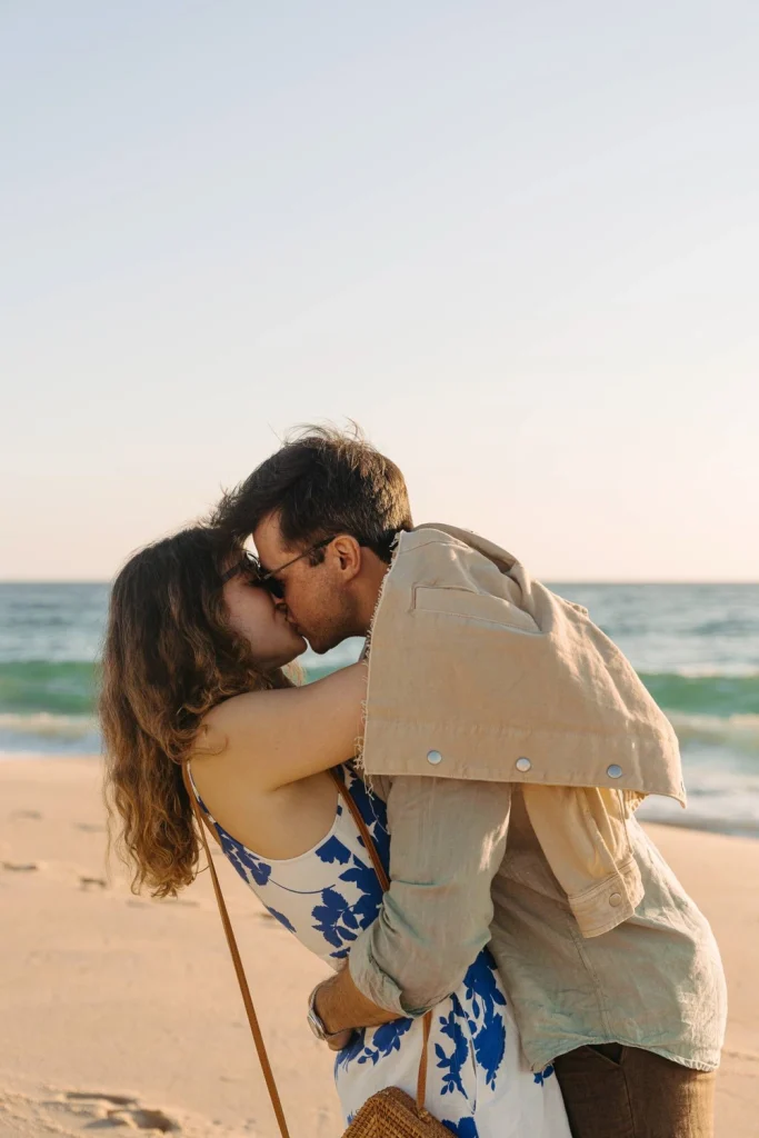Romantic beach proposal at sunset in portugal.