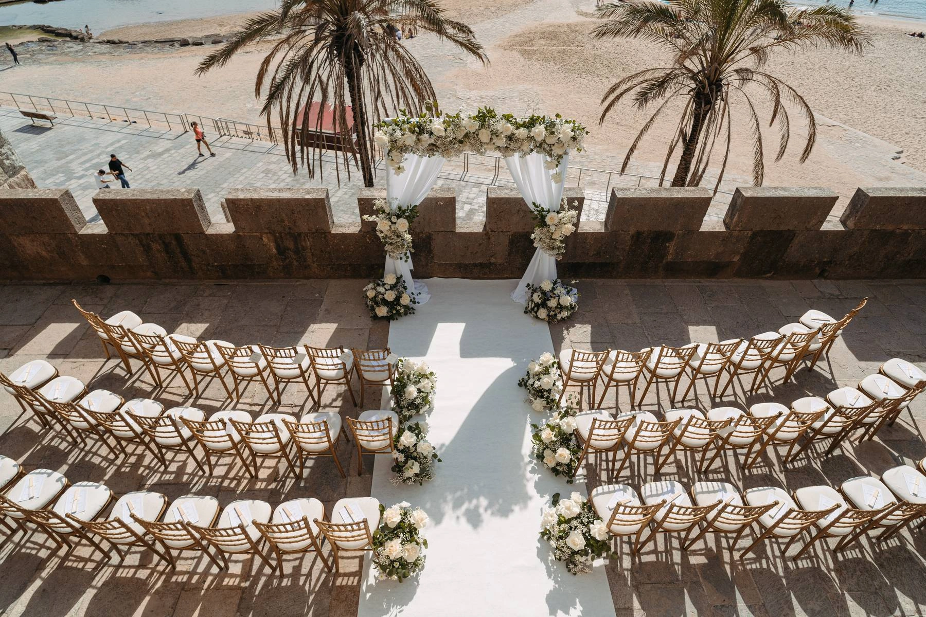 Outdoor beach ceremony setup with ocean view for a destination wedding in Portugal.