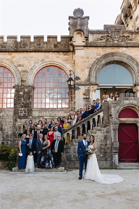 Wedding group photo in front of Forte da Cruz in Estoril after the ceremony.