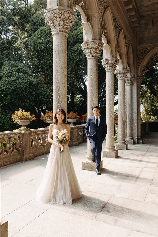 Bride and groom sharing a kiss at Monserrate Palace during a destination wedding in Portugal